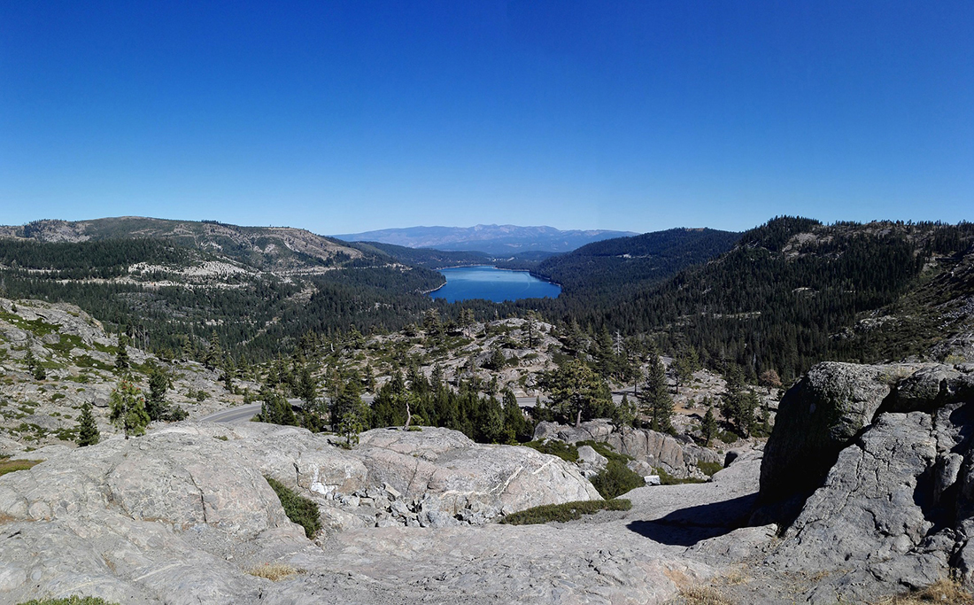 Donner Memorial State Park A rugged landscape with jewel-like lake in the distance.