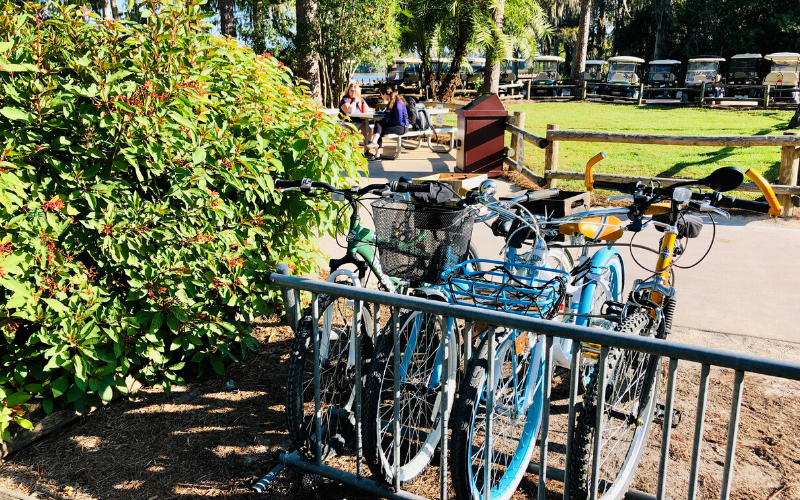 A bike rack with RVs in background.