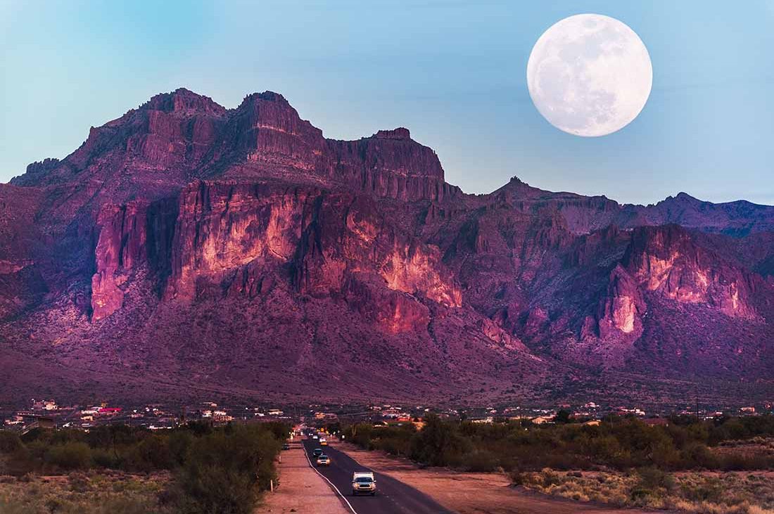 New Good Sam Parks Supermoon rises above rugged Superstition Mountains.