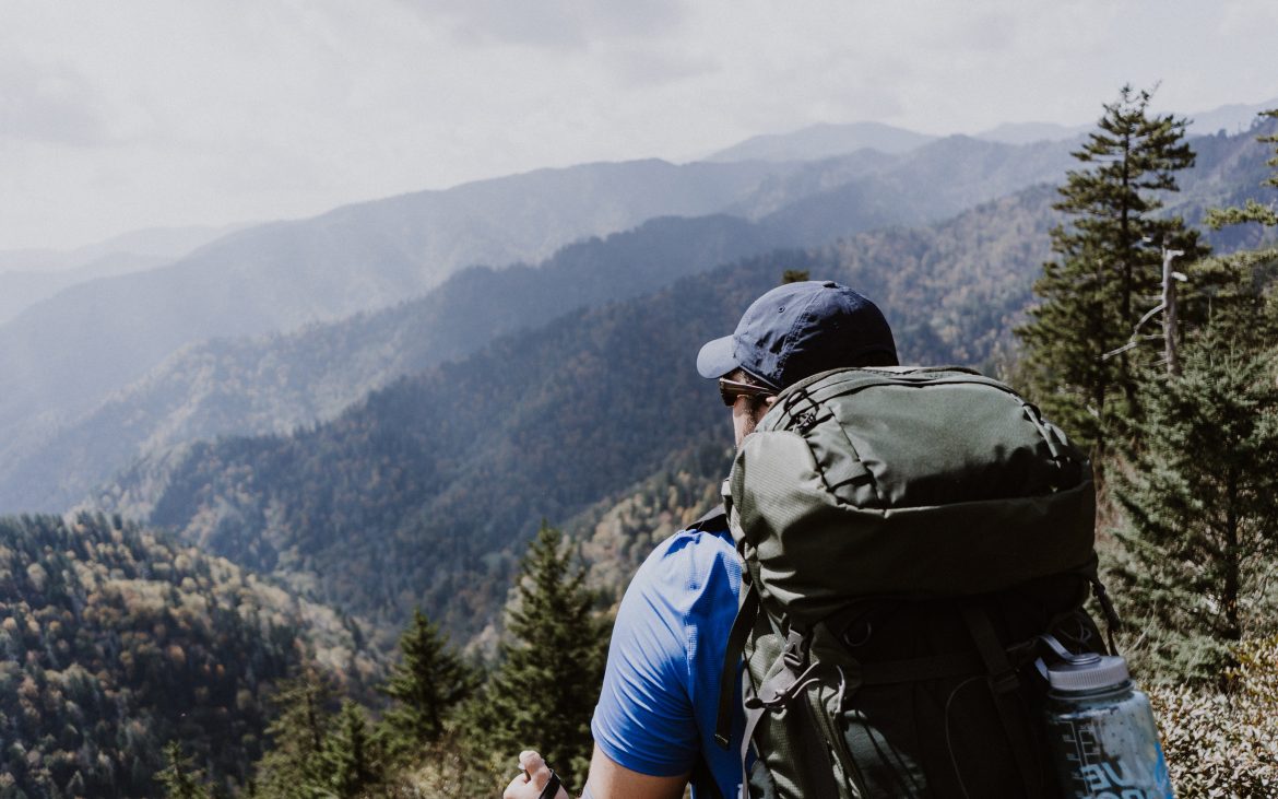 Male hiker gazing over beautiful Smoky Mountains 