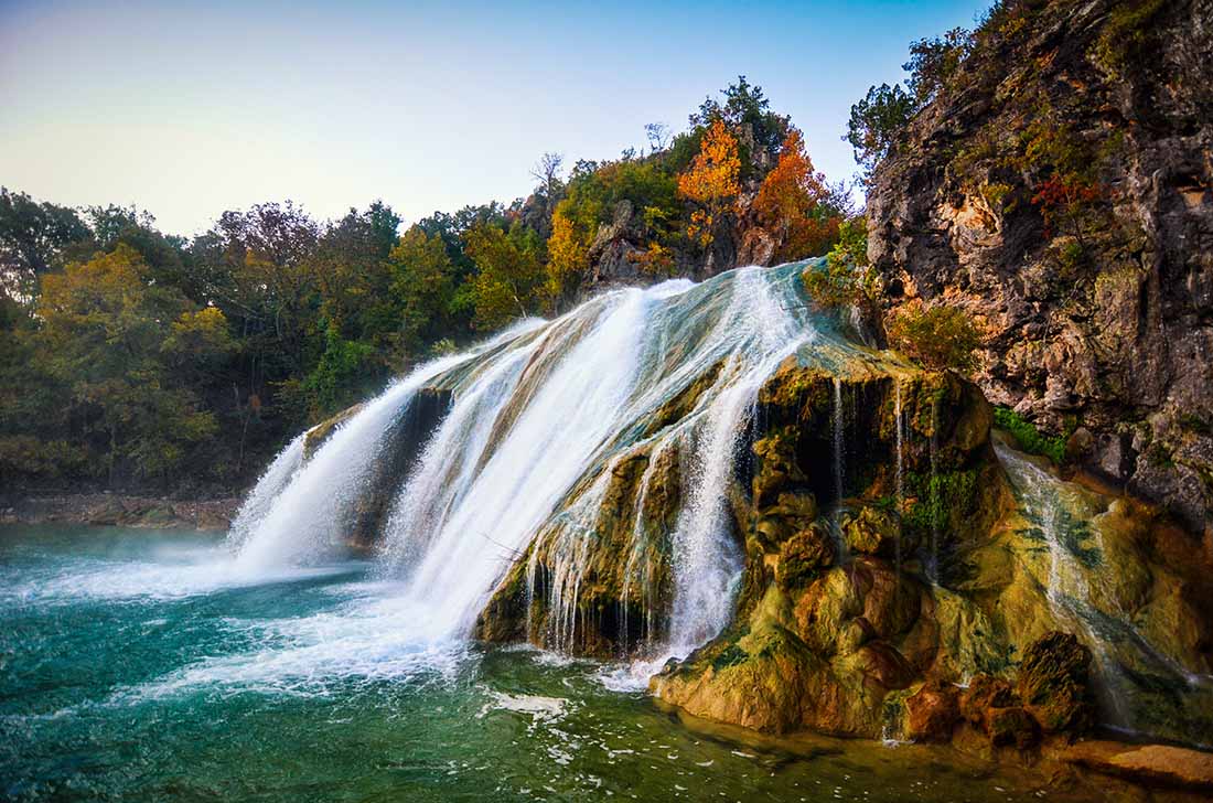 Waterfall in the fall with leaves changing in OK