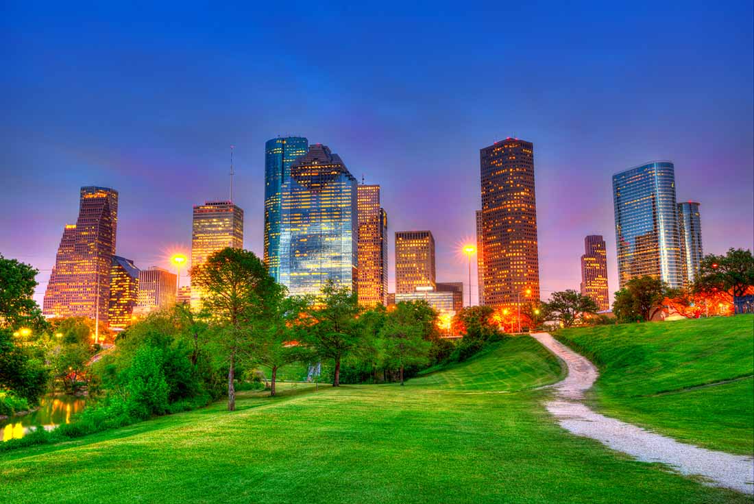 Houston Texas modern skyline at sunset twilight from park lawn HDRI