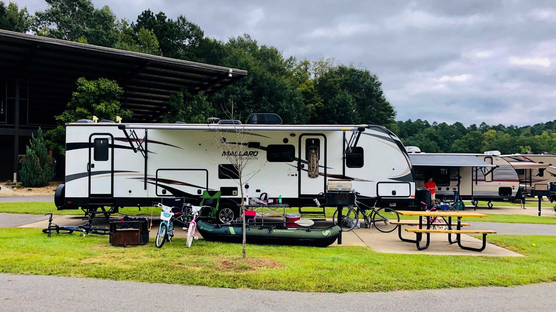 RVs with "toys" arrayed around the outside.