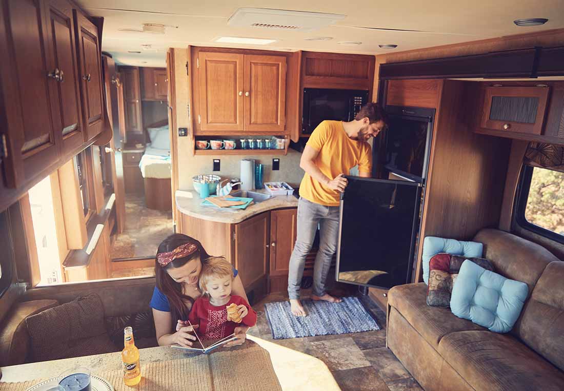 A family relaxing in their RV.