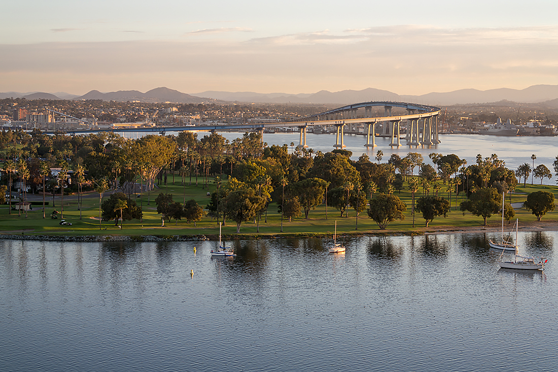 San Diego Bay scene with Coronado Bridge in background.