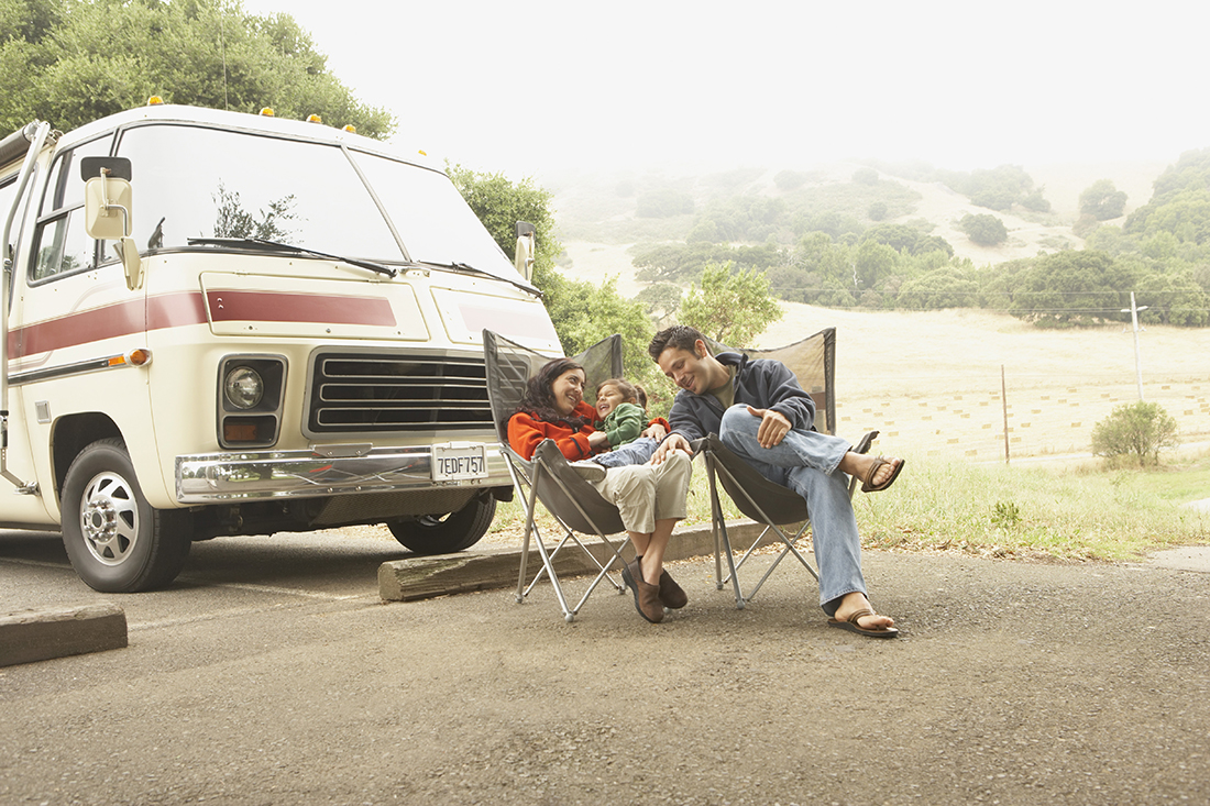 Family Camping A family in front of a motorhome.