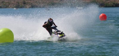 A jet ski zooms across the water.