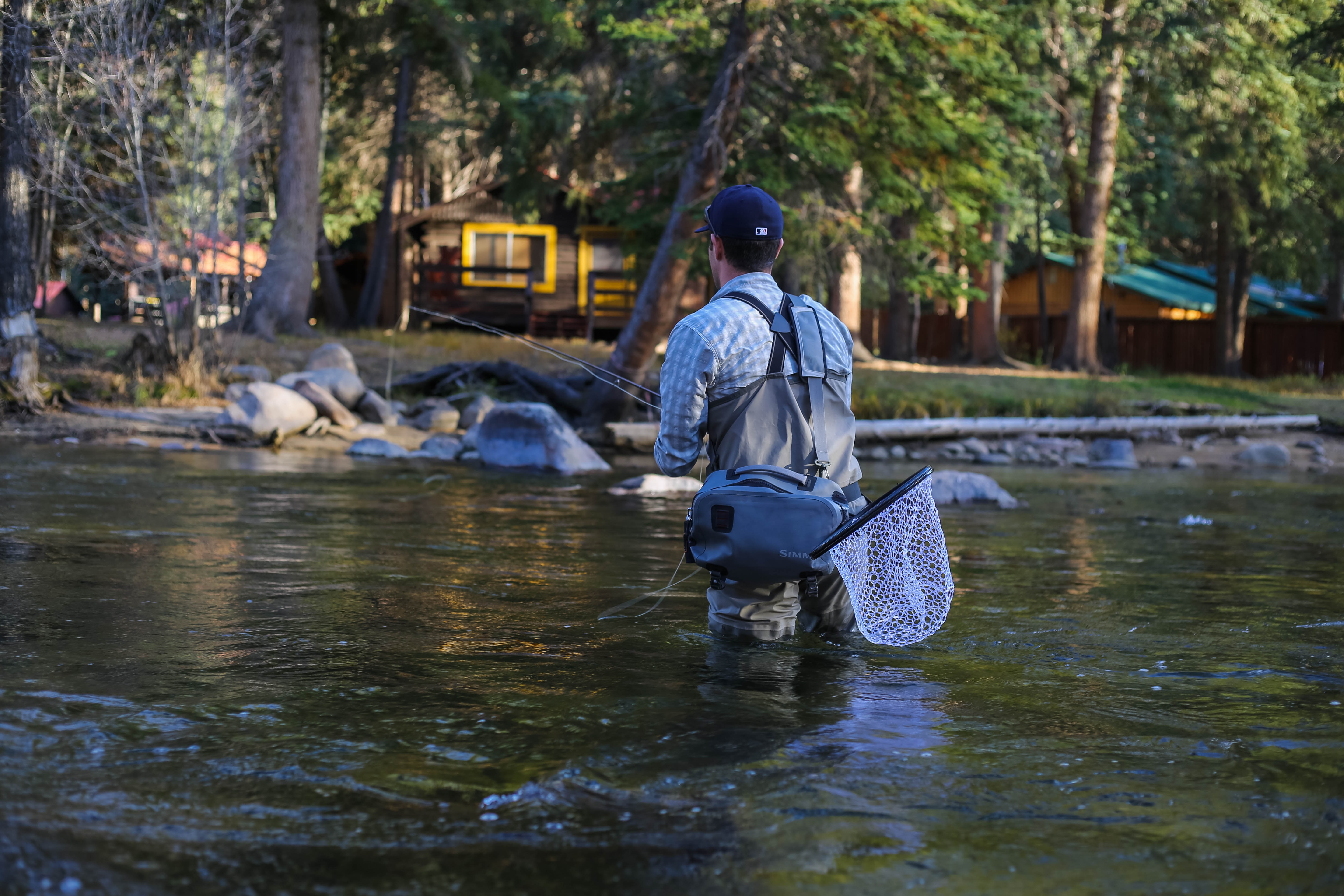 A fly fishing enthusiast wades into the Colorado Rier.