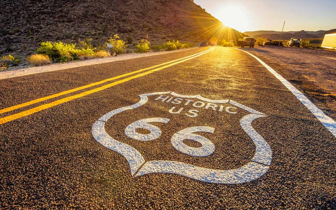 Historic Route 66 running through rugged desert country.