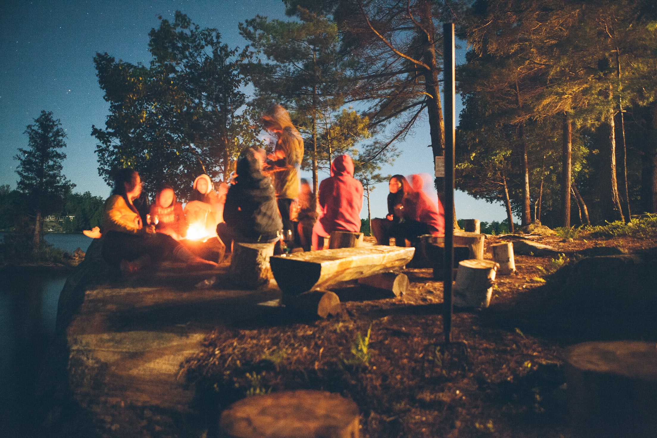 A group of people around a campfire.
