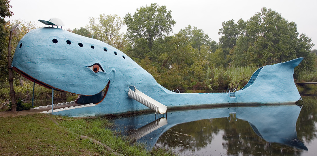 OK Blue Whale A giant plaster whale in a shallow pond