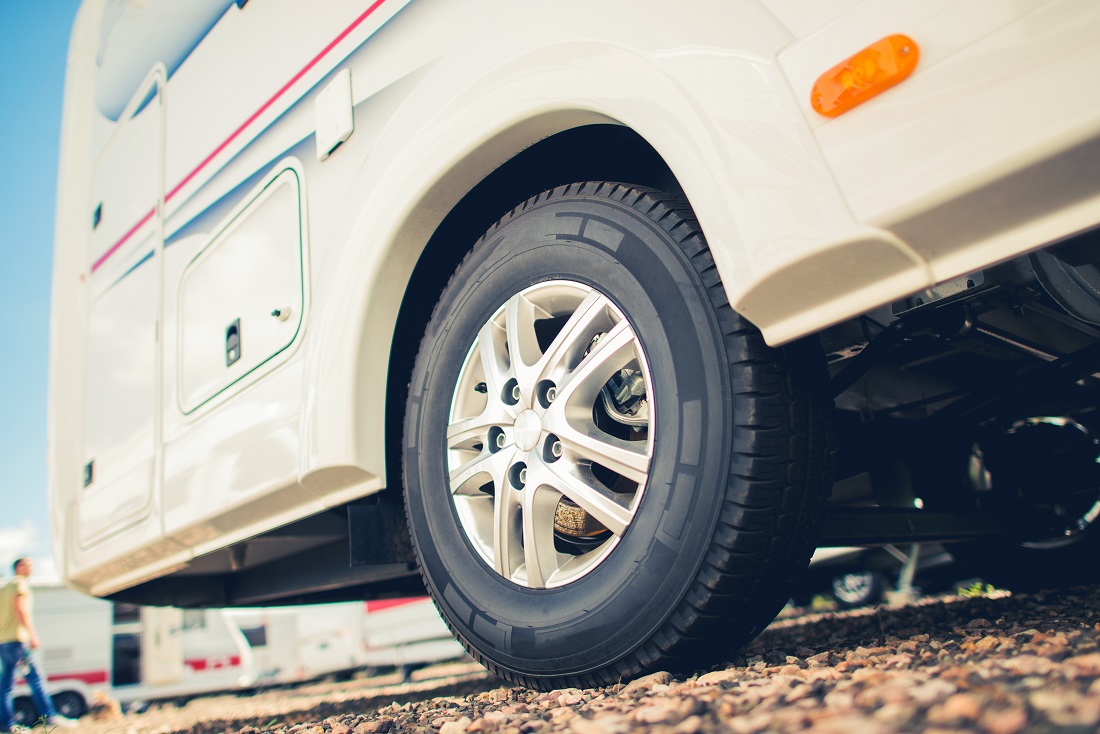 Ground-level view of motorhome tires.