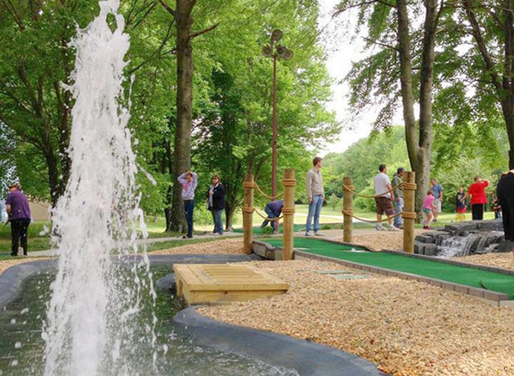 People gathered around a playground.