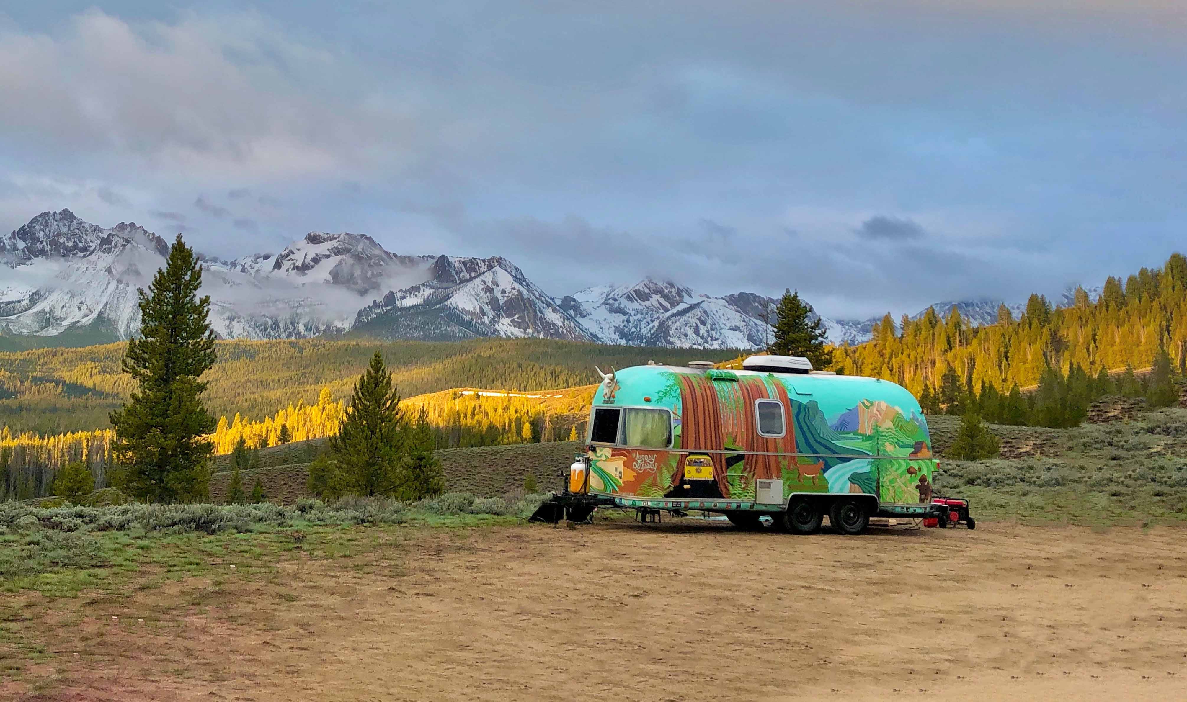 Colorful Travel Trailer Colorfully painted travel trailer in clearing