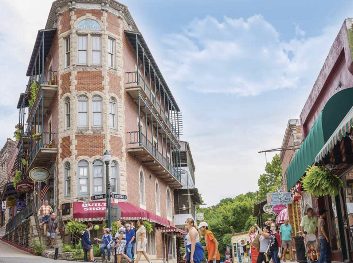 Tourists stroll a Eureka Springs Street.