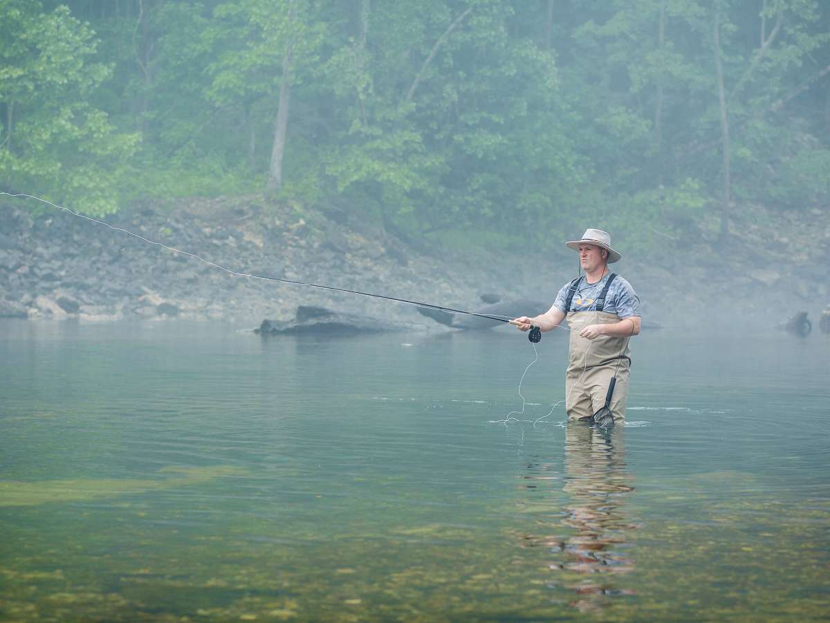 Man fly fishing in Eureka Springs