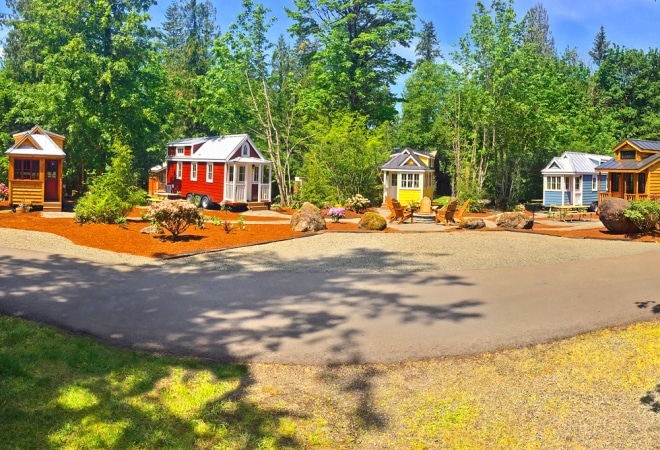 Colorful cabins arrayed around a clearing.