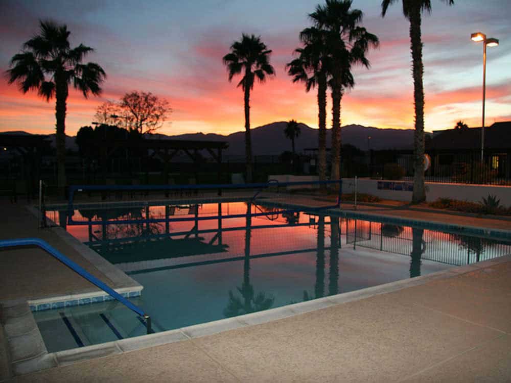 Sunset reflected on placid pool.