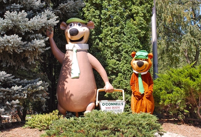 Statues of two bears at a campground.