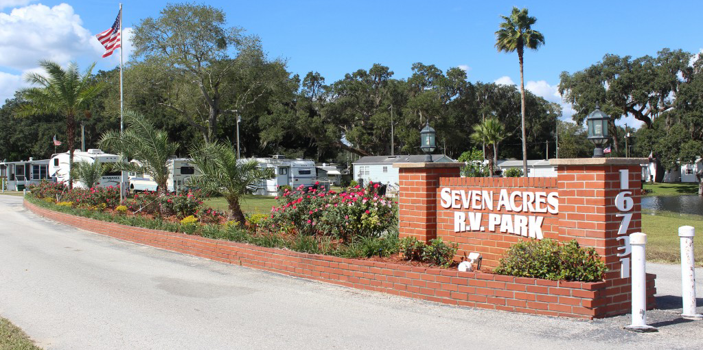 Brick sign indicating "Seven Acres R.V. Park" a new Good Sam Park