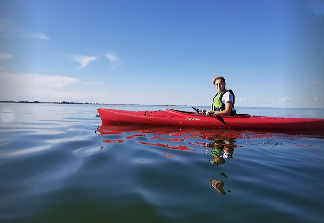 Girl on a red kayak