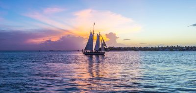 Sunset at Key West with sailing boat and bright sky