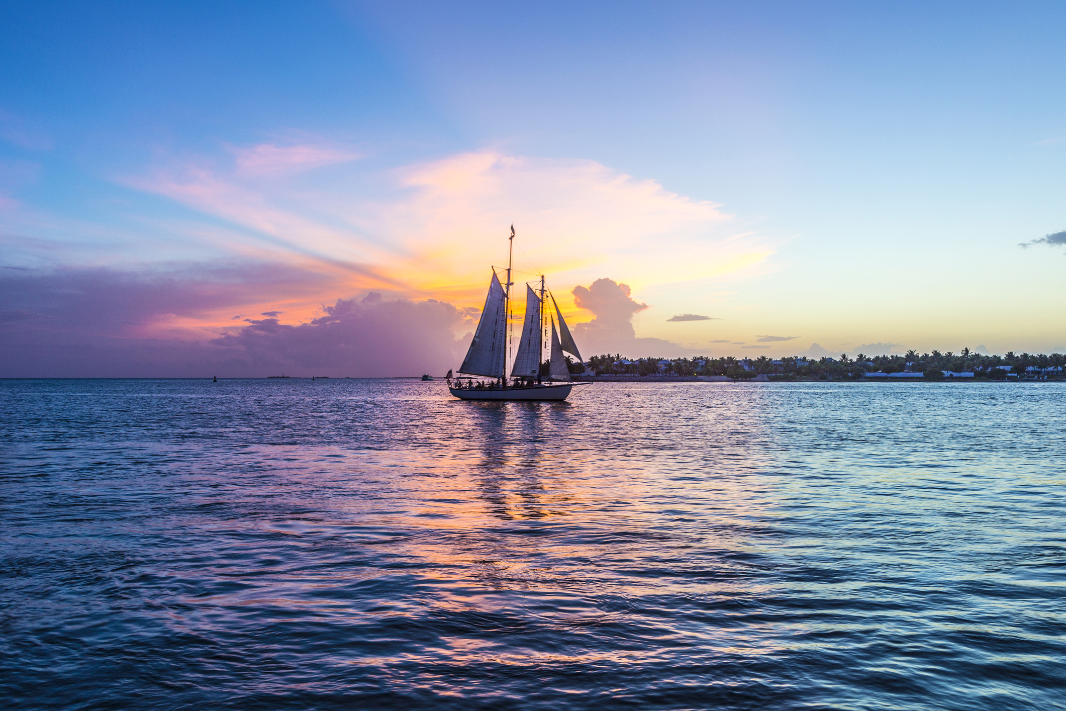 Sunset at Key West with sailing boat and bright sky
