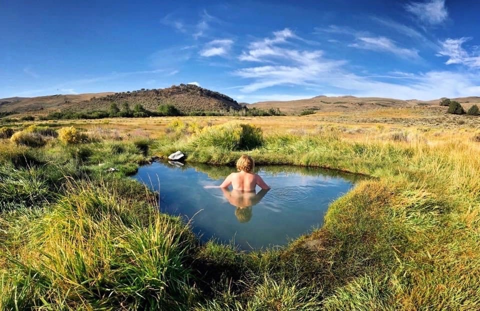 Woman sitting in hot springs at Antelope Hot Springs in Oregon