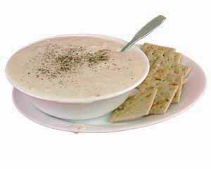 Bowl of clam chowder with crackers