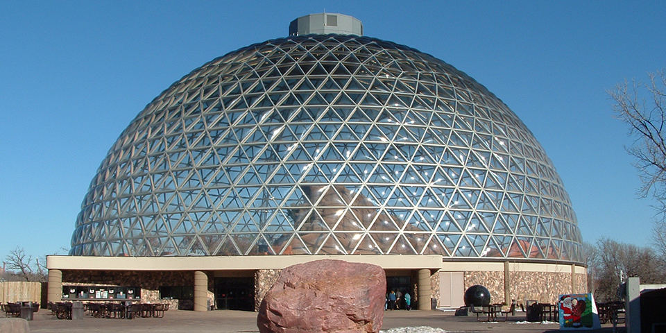 Geodesic dome against a blue sky.