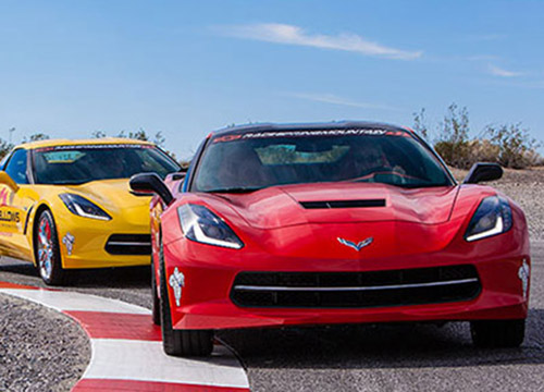 Corvettes on a road course