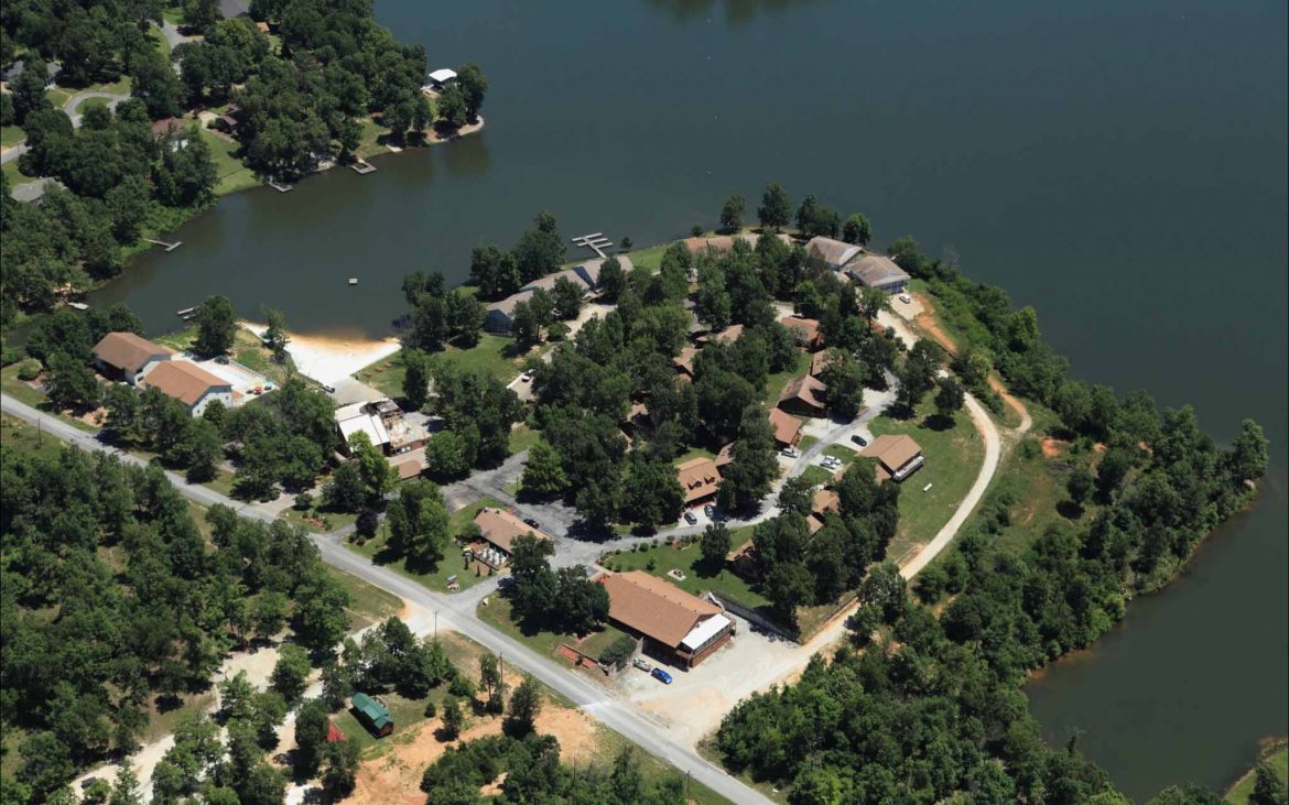 aerial shot of campground on peninsula jutting into lake.