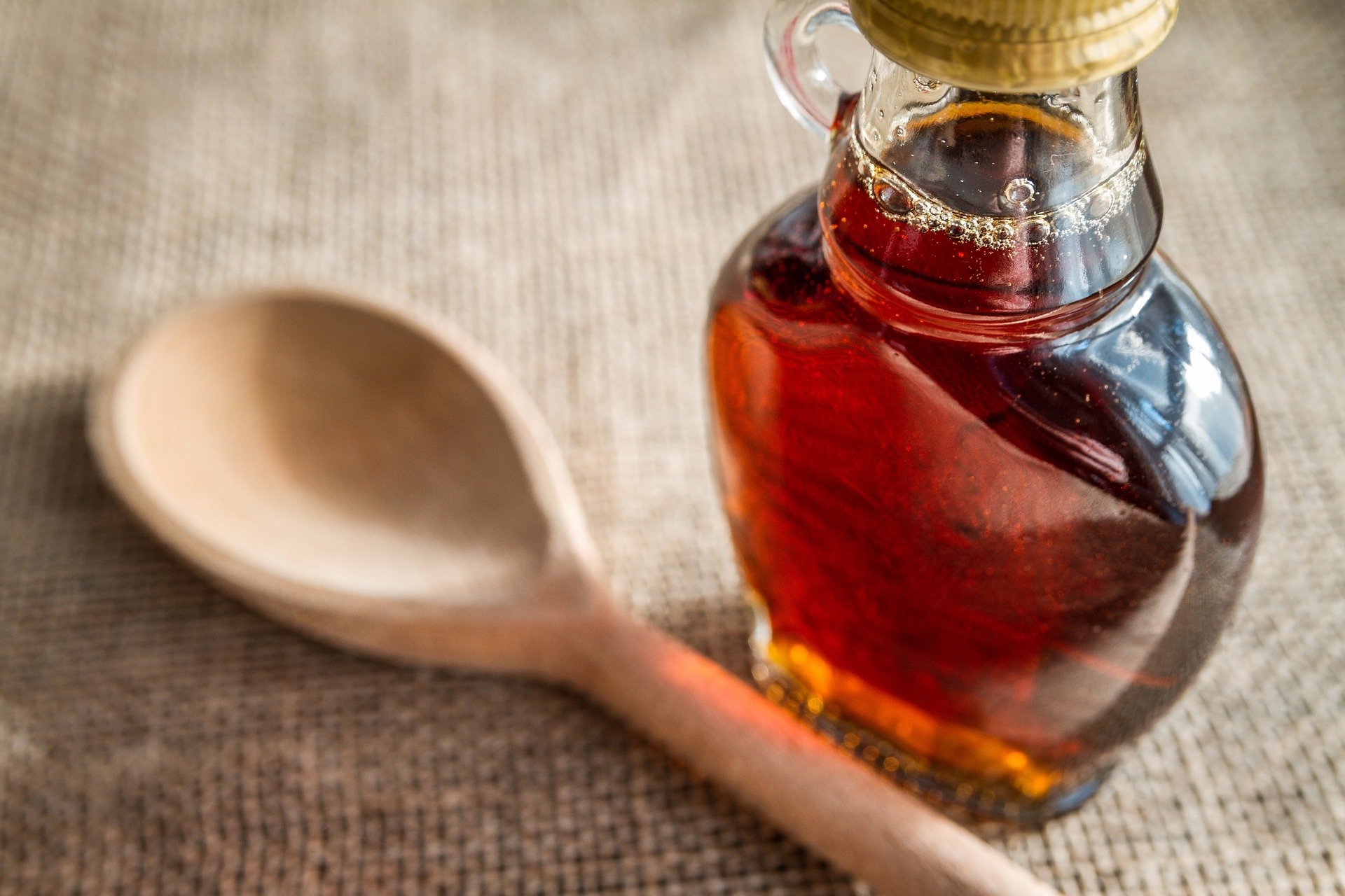 Glass bottle of maple syrup
