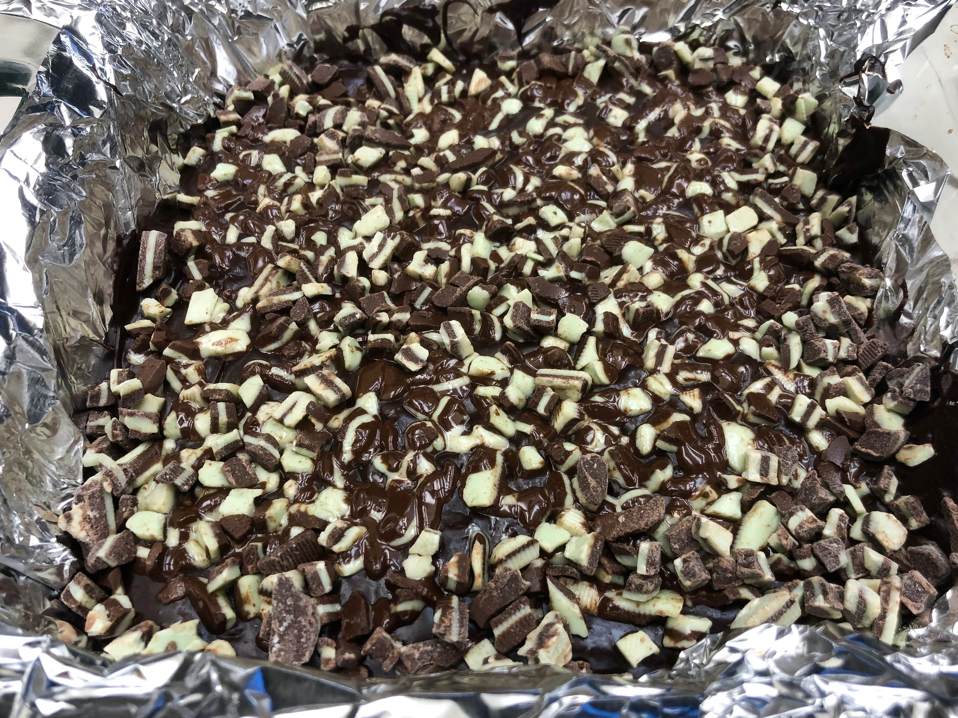 a pile of chocolate and vanilla white fudge bits