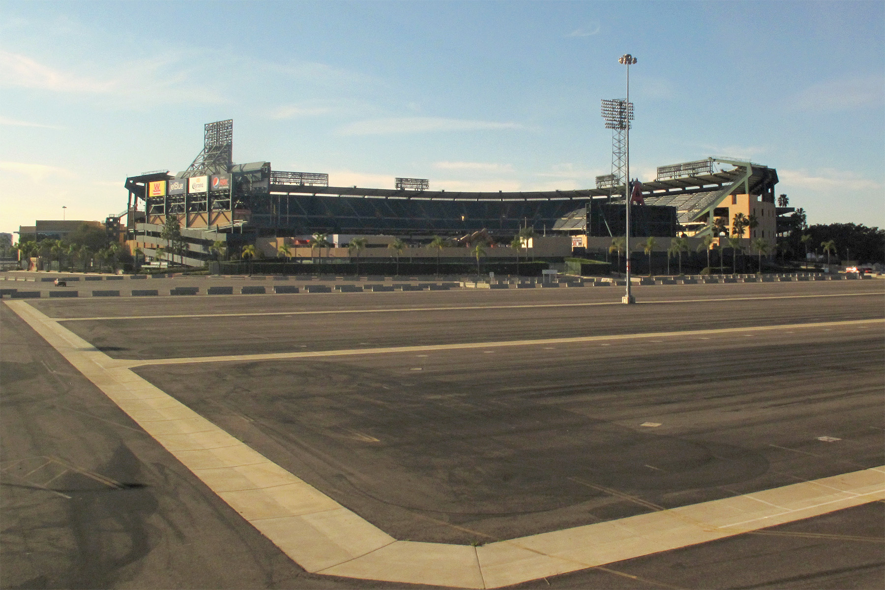 Baseball stadium viewed from a parking lot.