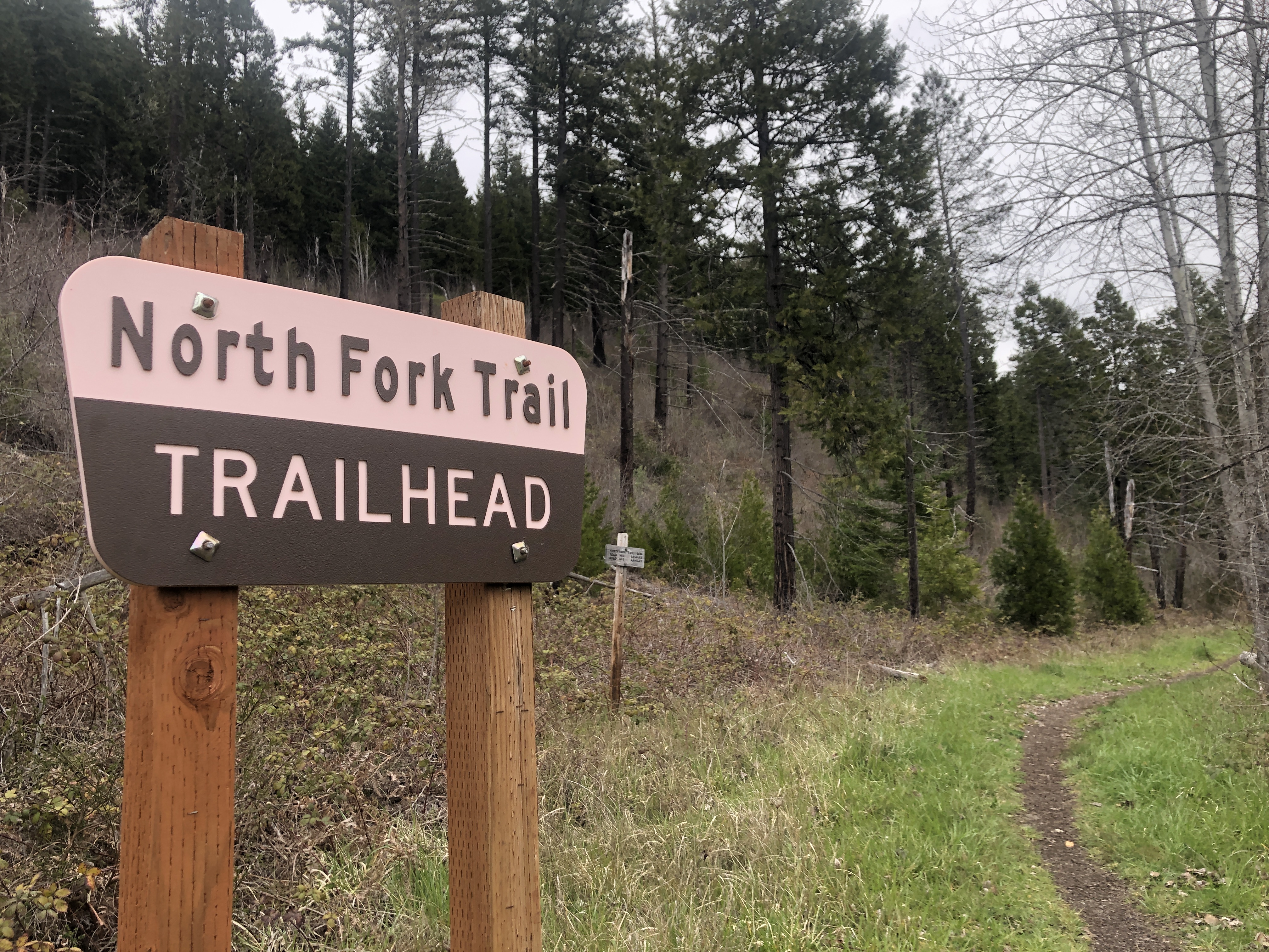 A sign indicating "North Fork Trail"