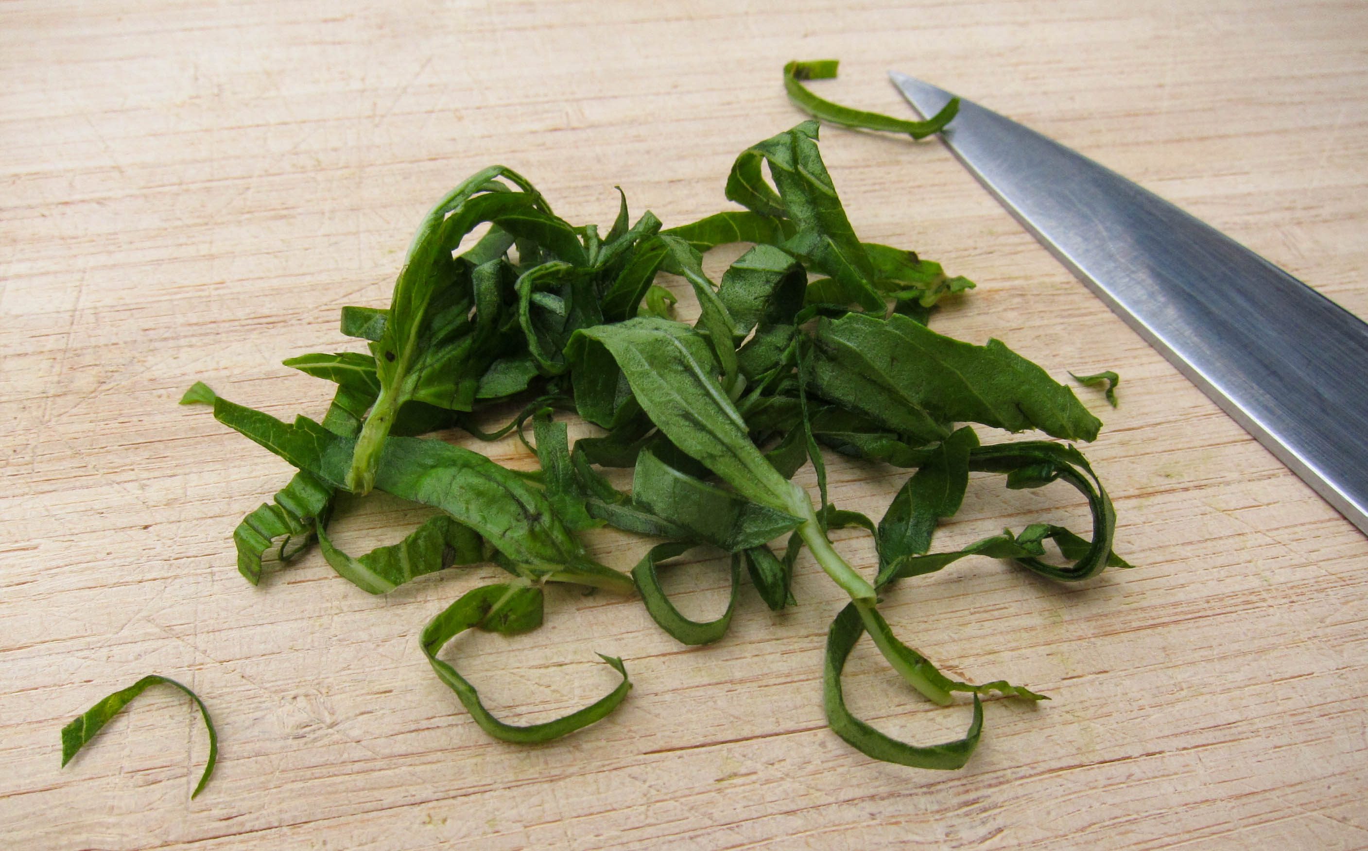 Basil cut up with knife,