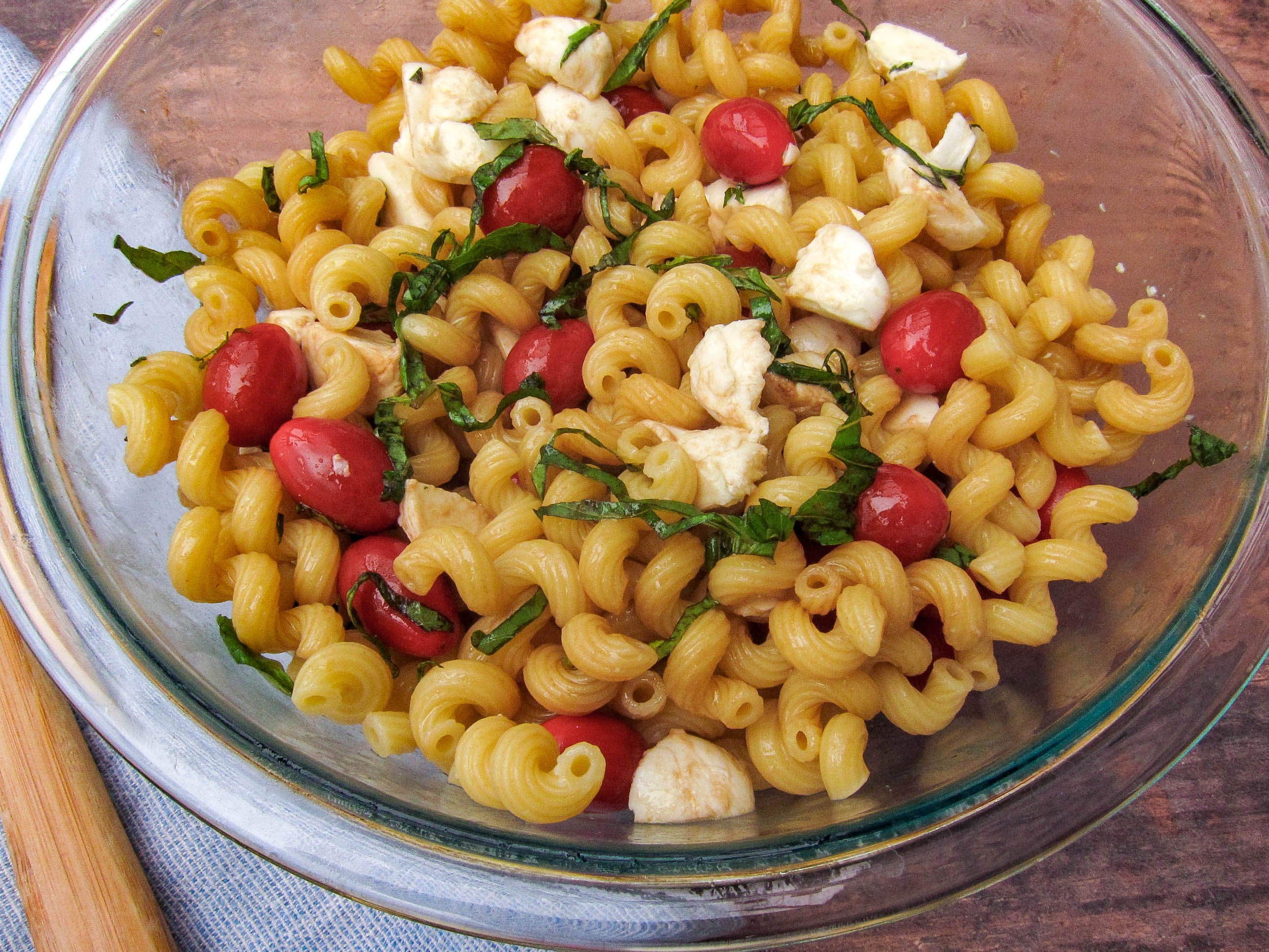 Pasta Salad mixed with dressed added. 
