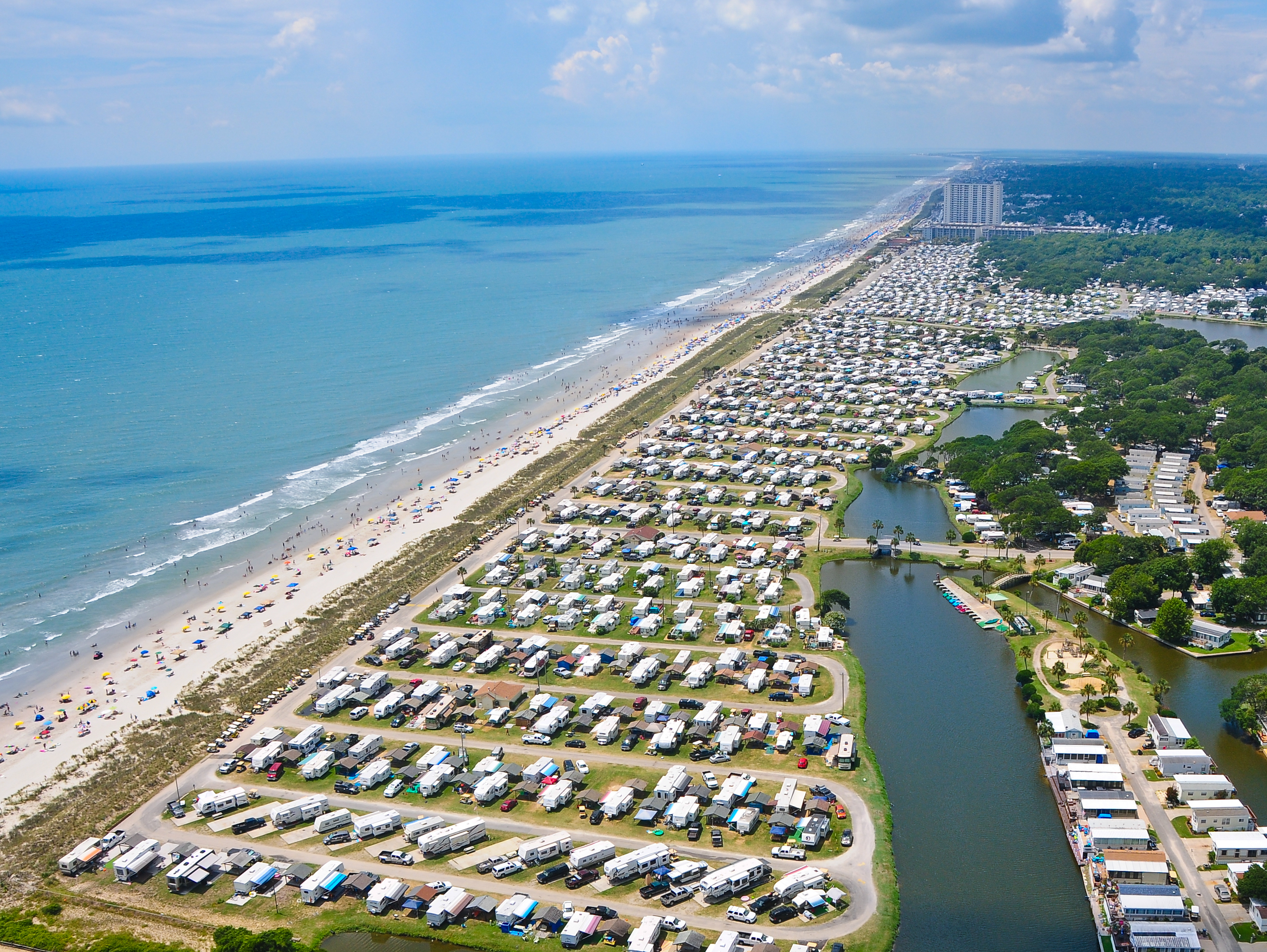 Camping Capital of the World — arial view of RVs parked on coast.