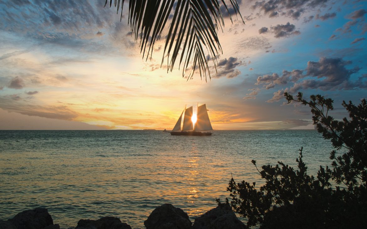 Sailboat at sunset at Fort Zachary Taylor State Park Beach, Key West
