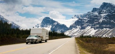 Summer of RVing — fifth-wheel rolling down a highway.