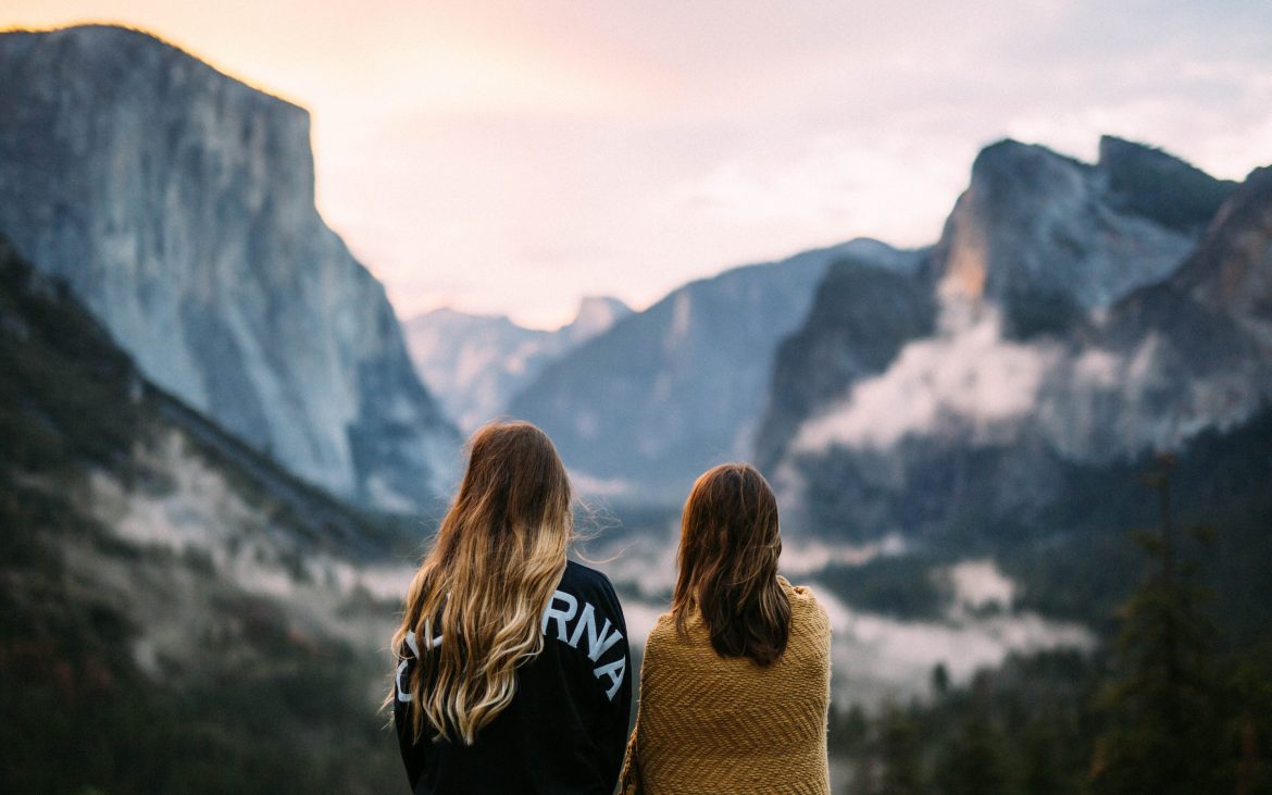 Two girls gazing at Tunnel View view