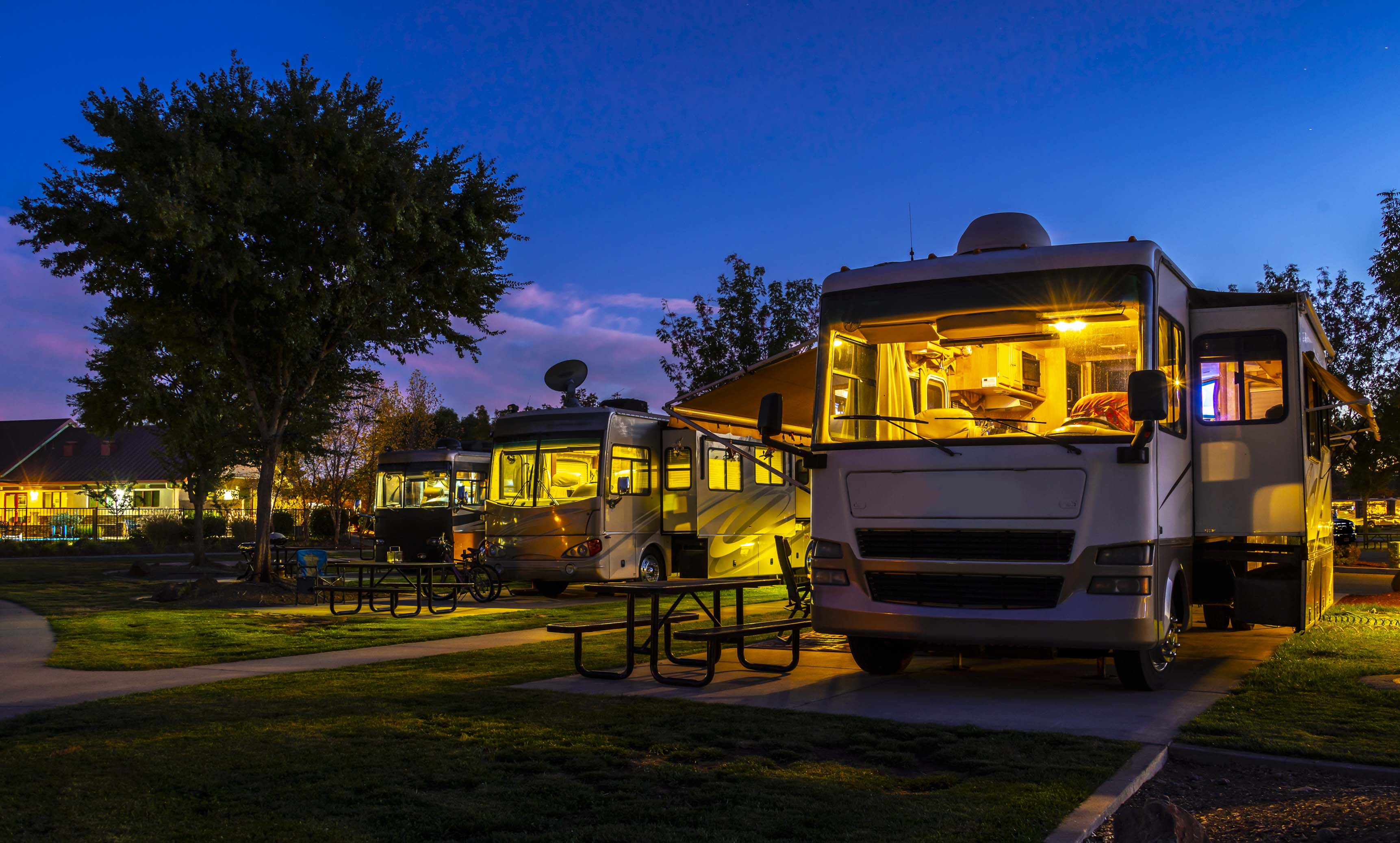 RVs in the evening with lights on.