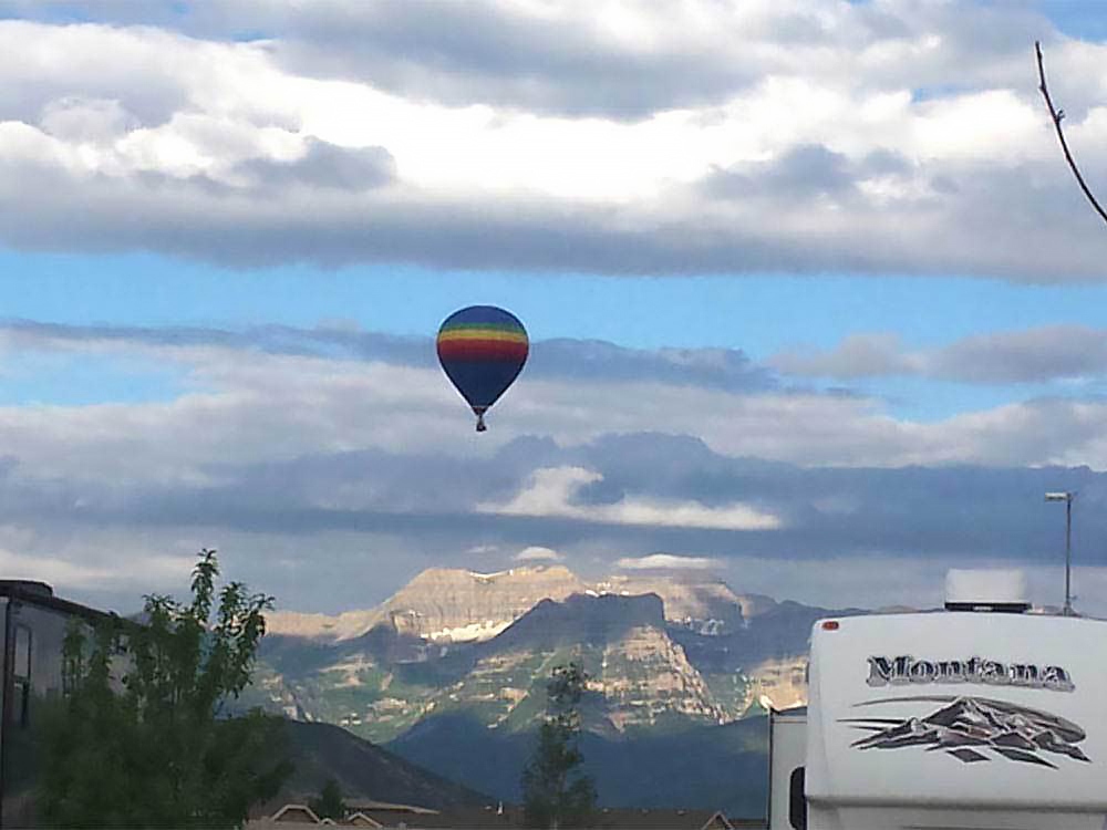 A balloon sails high above a Montana fifth-wheel.