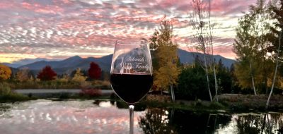 Southern Oregon — a glass of red wind against a sunset sky.