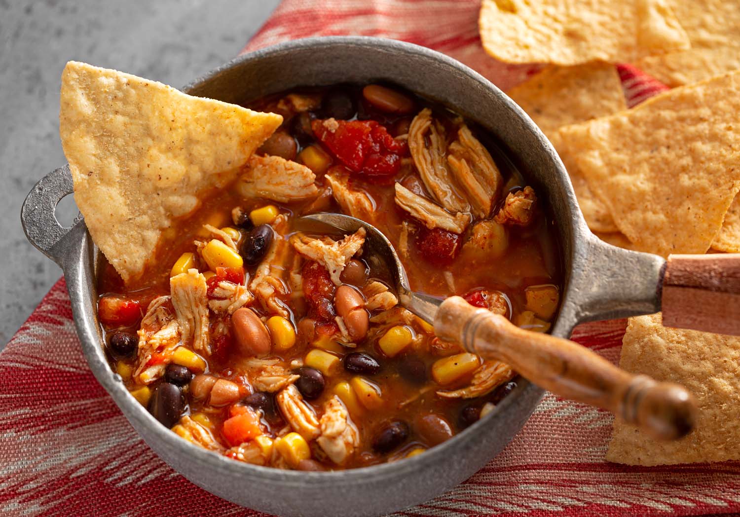 Homemade taco chicken soup in a rustic pot