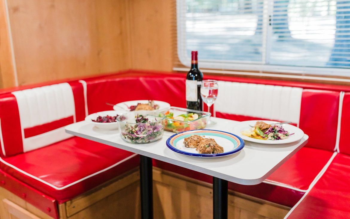 A Delicious Meal Served in a Recreational Vehicle with Red and White.