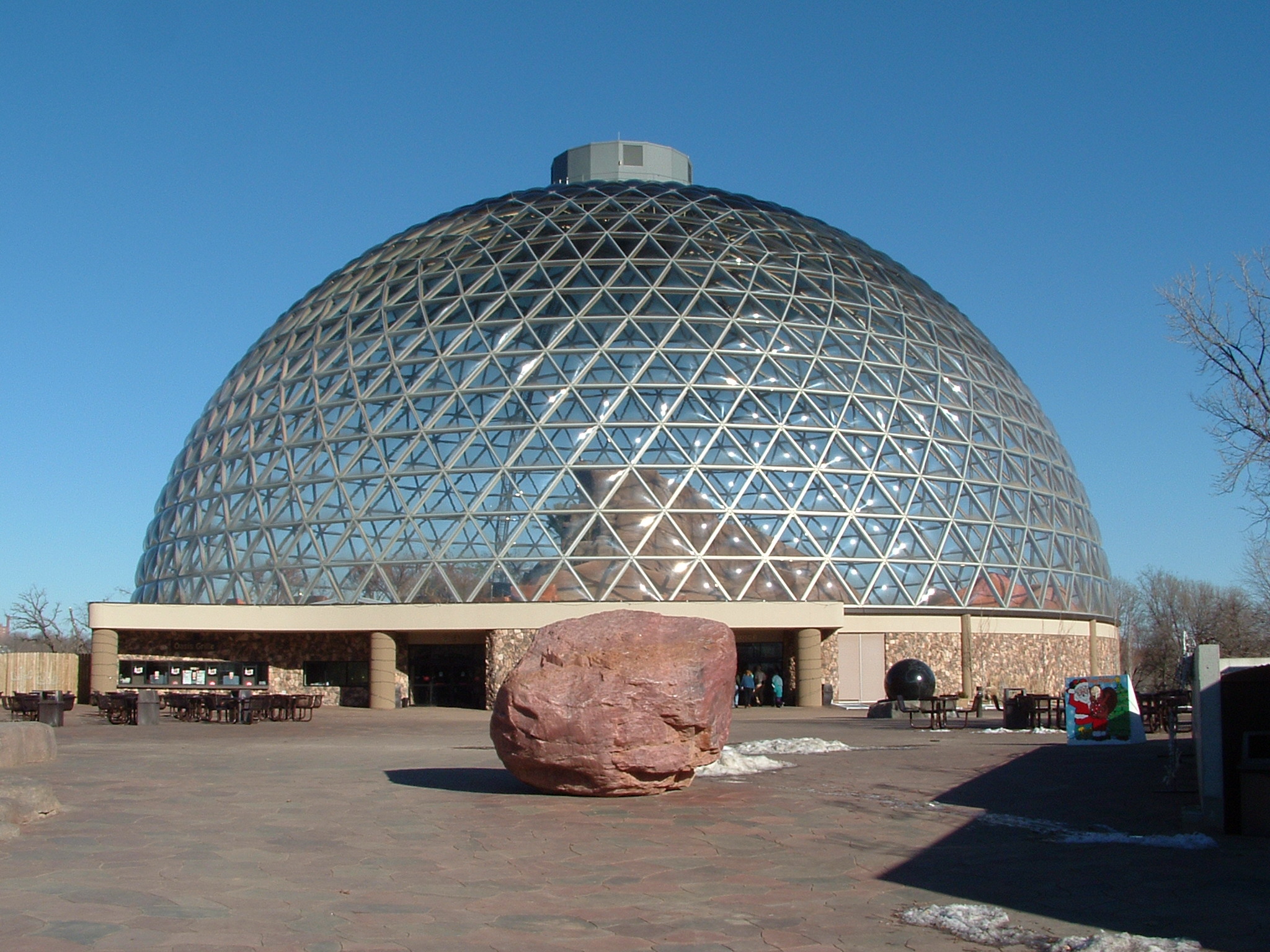 A geodesic dome over a desert landscape.