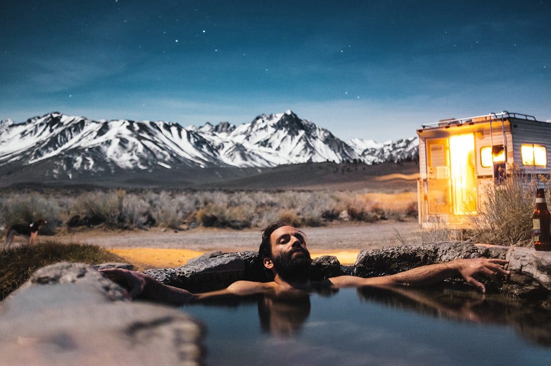 Man relaxes in hot spring
