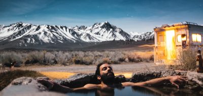 Man relaxes in hot spring
